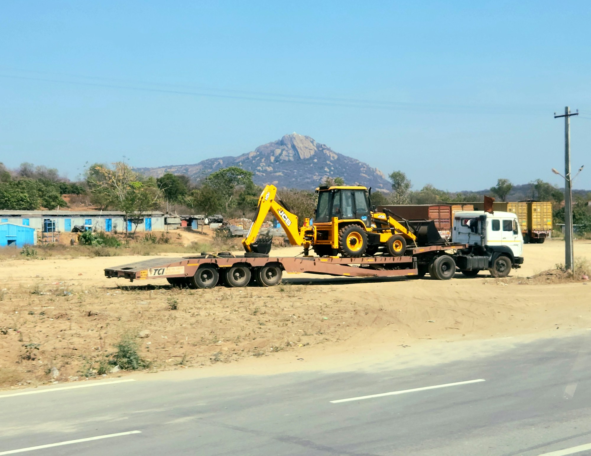 Construction equipment beside a highway in Tamil Nadu, India